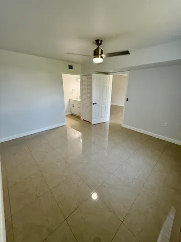 an empty room with a bathroom