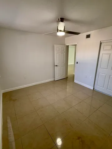 a bathroom with a double vanity sink toilet and shower