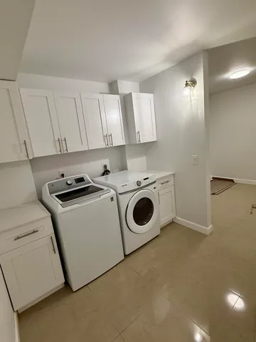 a view of swimming pool with outdoor seating and city view