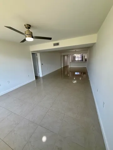 a view of a glass door with a big yard