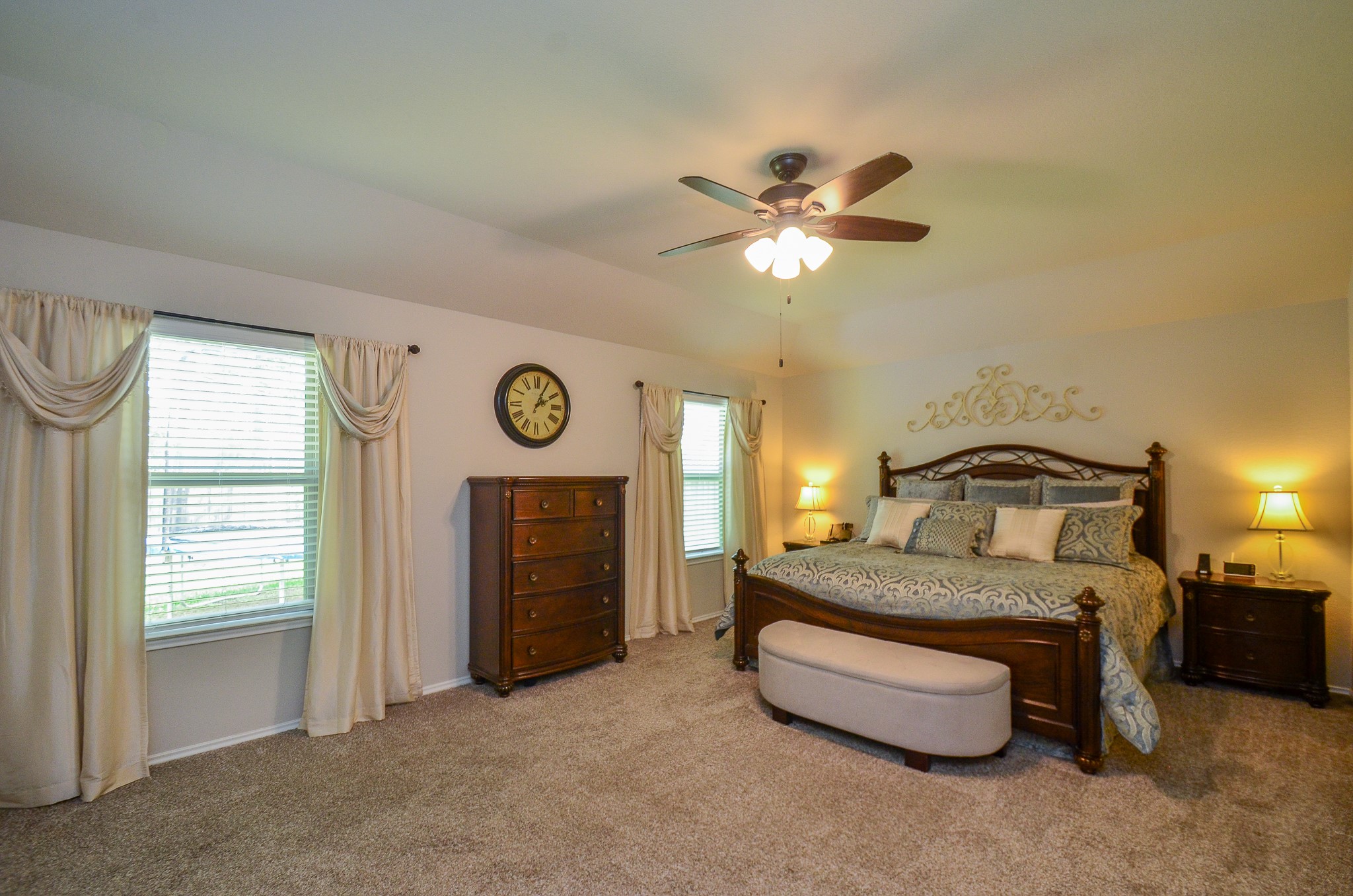 3810 Willow Valley Conroe, TX 77301 - Photo 20 of 38 a bedroom with a bed and a chandelier
