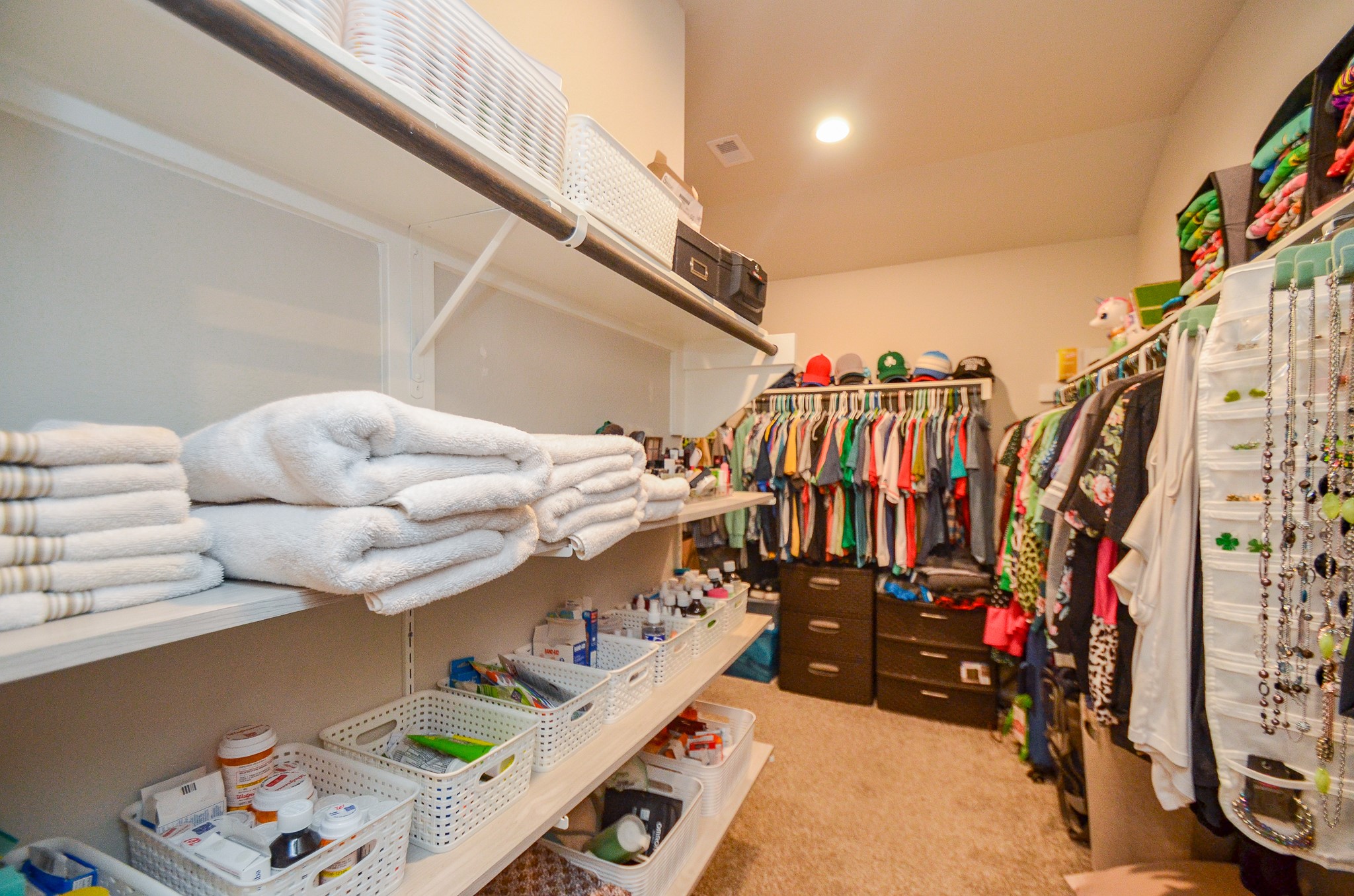 3810 Willow Valley Conroe, TX 77301 - Photo 23 of 38 a view of walk in closet with clothes and shoes
