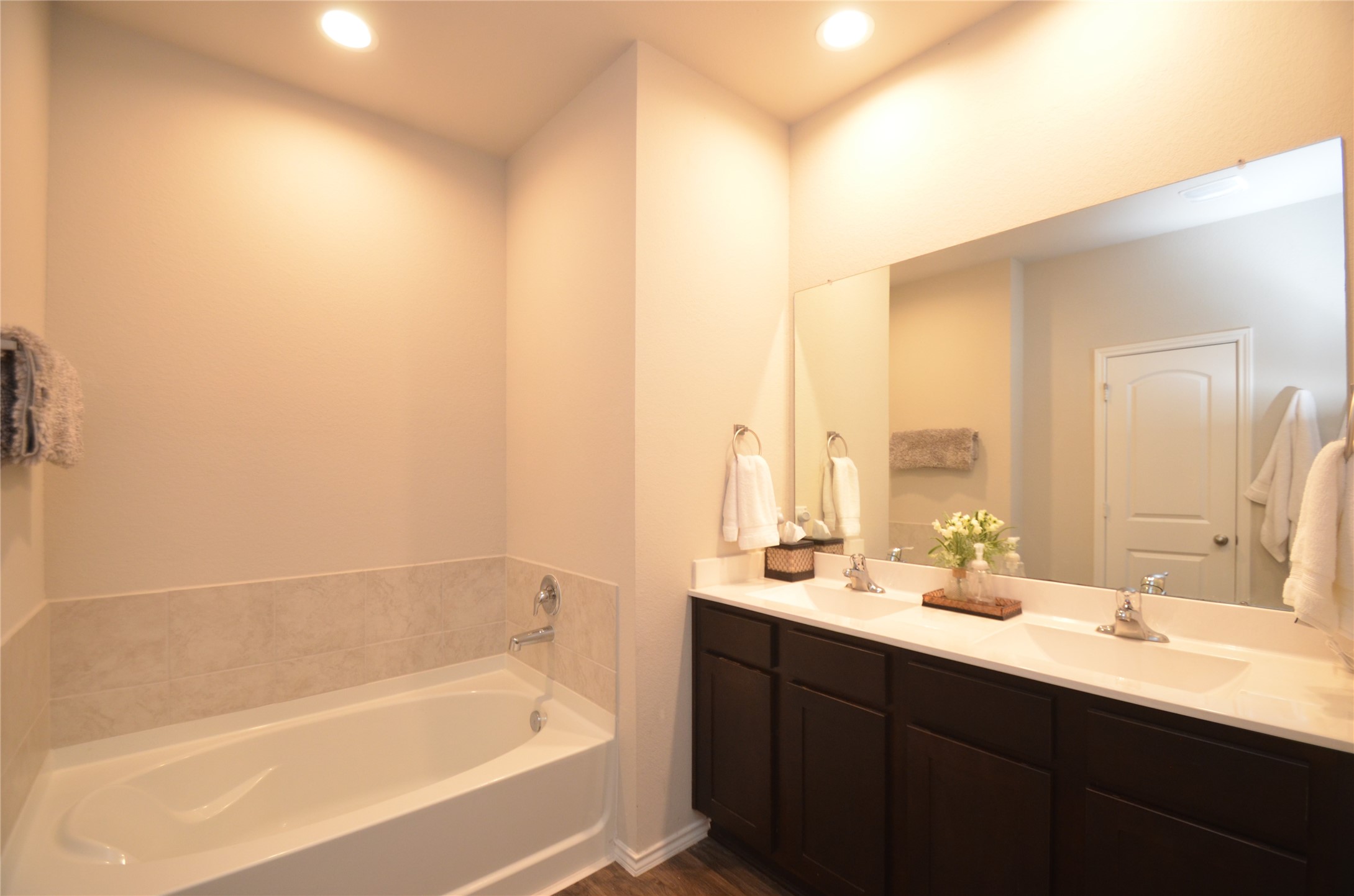 3810 Willow Valley Conroe, TX 77301 - Photo 26 of 38 a bathroom with a bathtub sink and mirror