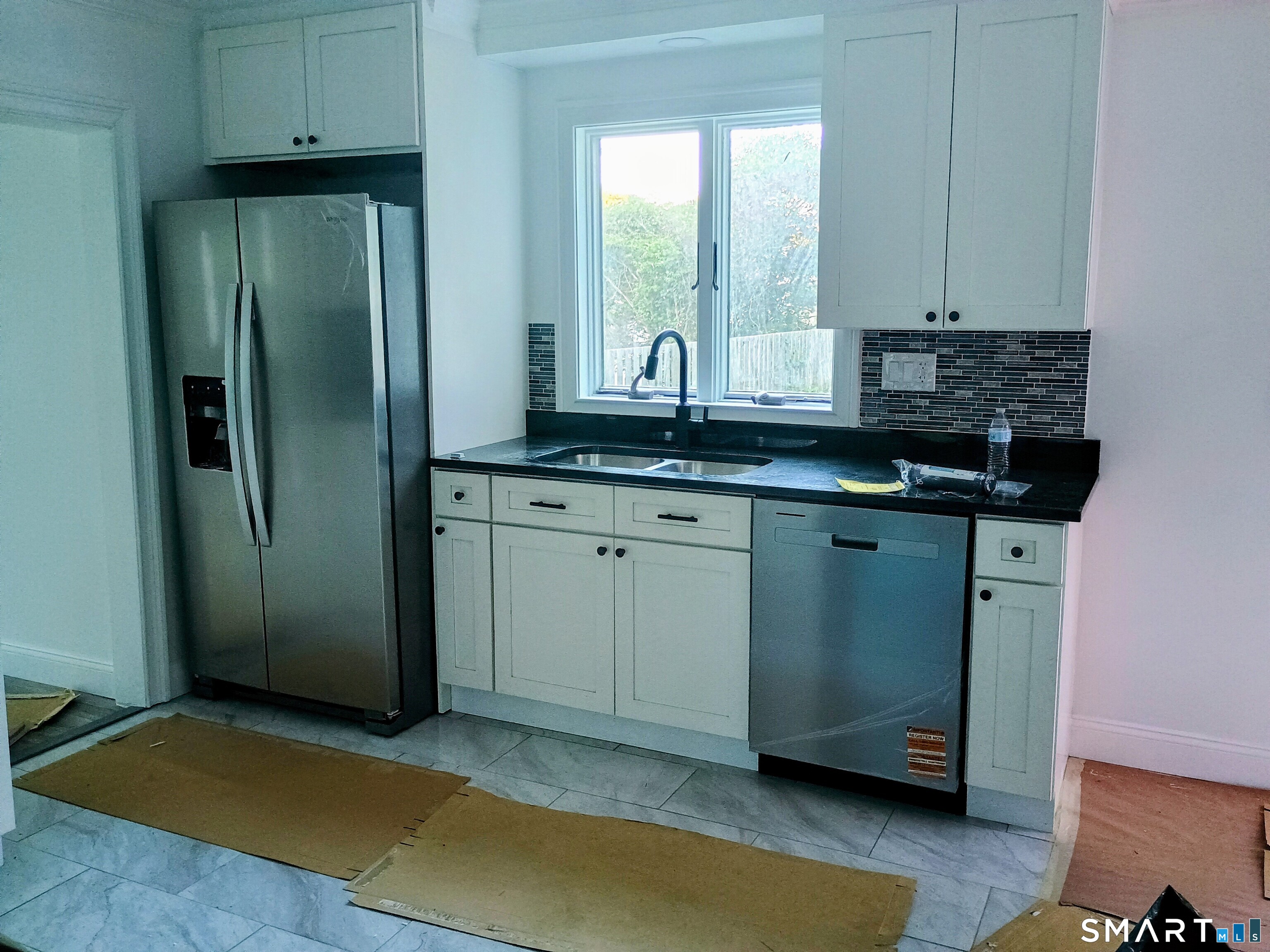 633 Wauregan Road Brooklyn, CT 06234 - Photo 2 of 17 a kitchen with stainless steel appliances granite countertop a sink a refrigerator and a cabinets