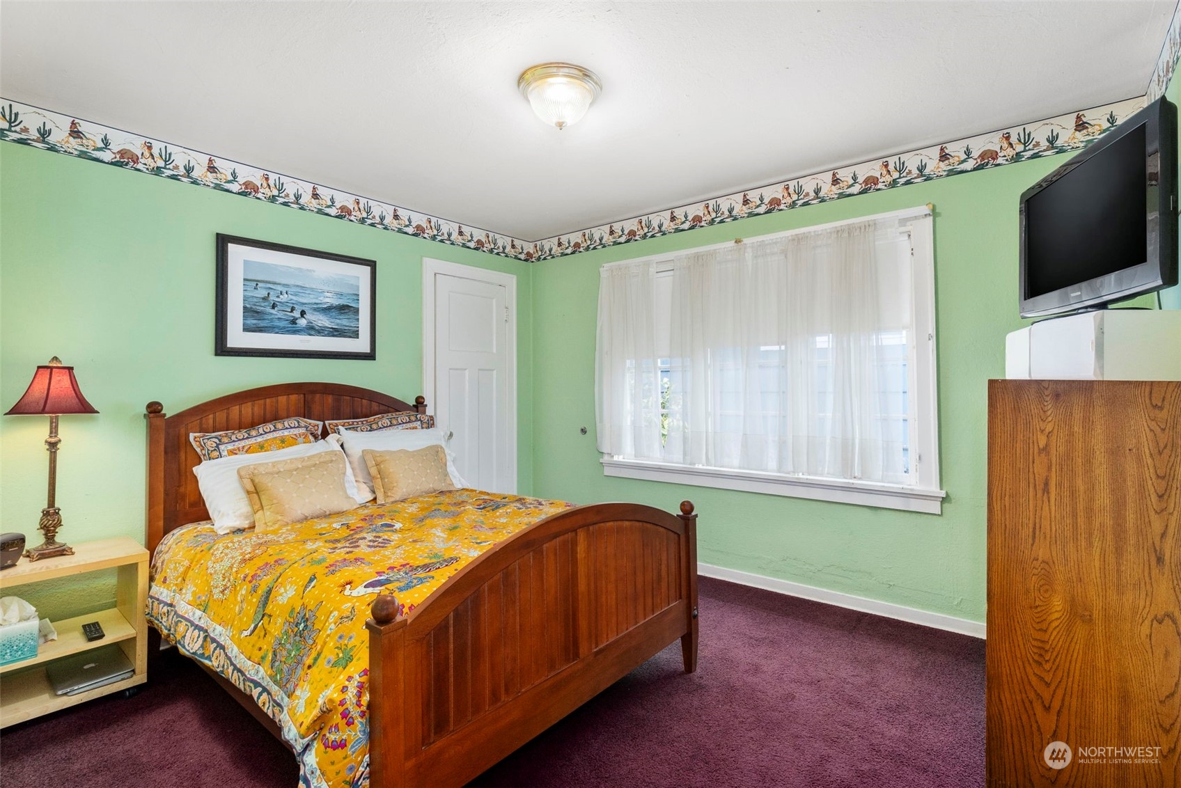 1745 4th Street Bremerton, WA 98337 - Photo 11 of 29 a bedroom with a bed and a flat screen tv