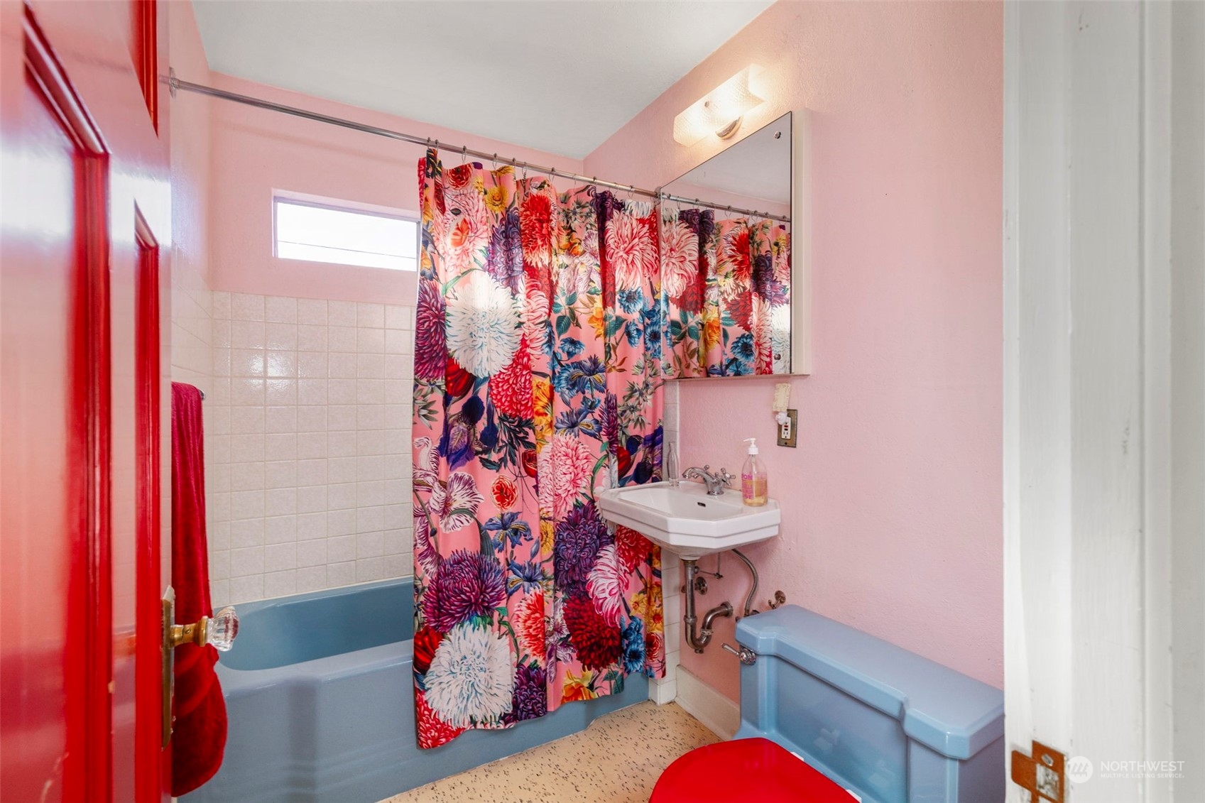 1745 4th Street Bremerton, WA 98337 - Photo 13 of 29 a bathroom with a sink toilet and shower curtain