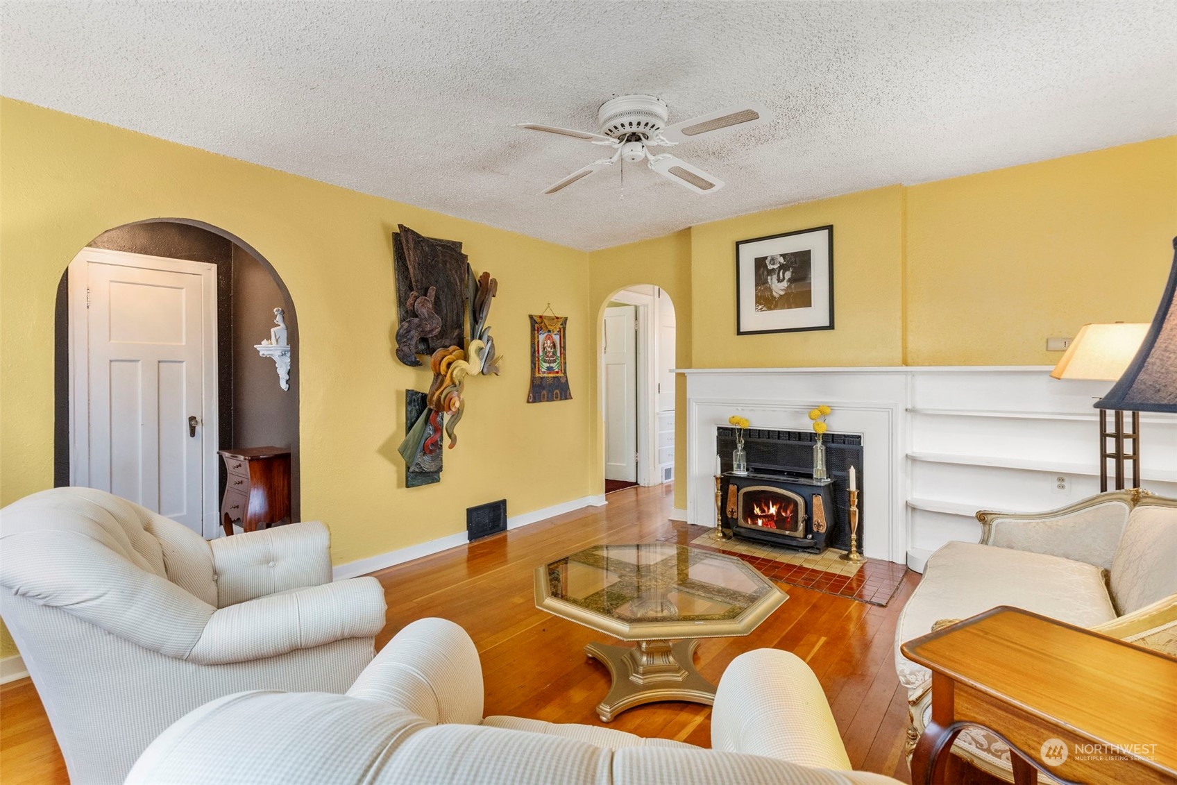 1745 4th Street Bremerton, WA 98337 - Photo 6 of 29 a living room with fireplace furniture and a wooden floor