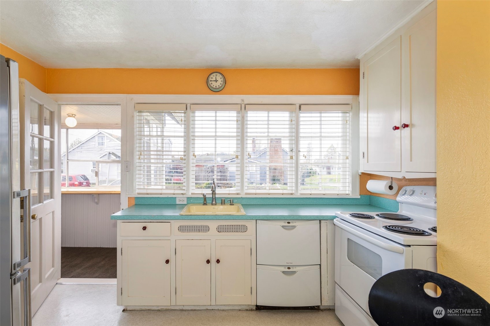 1745 4th Street Bremerton, WA 98337 - Photo 7 of 29 a kitchen with a sink stove and cabinets