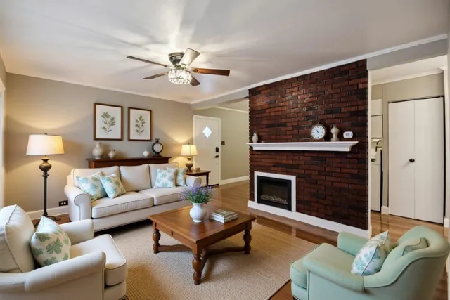 a living room with furniture and a fireplace