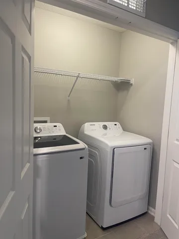 a utility room with dryer and washer