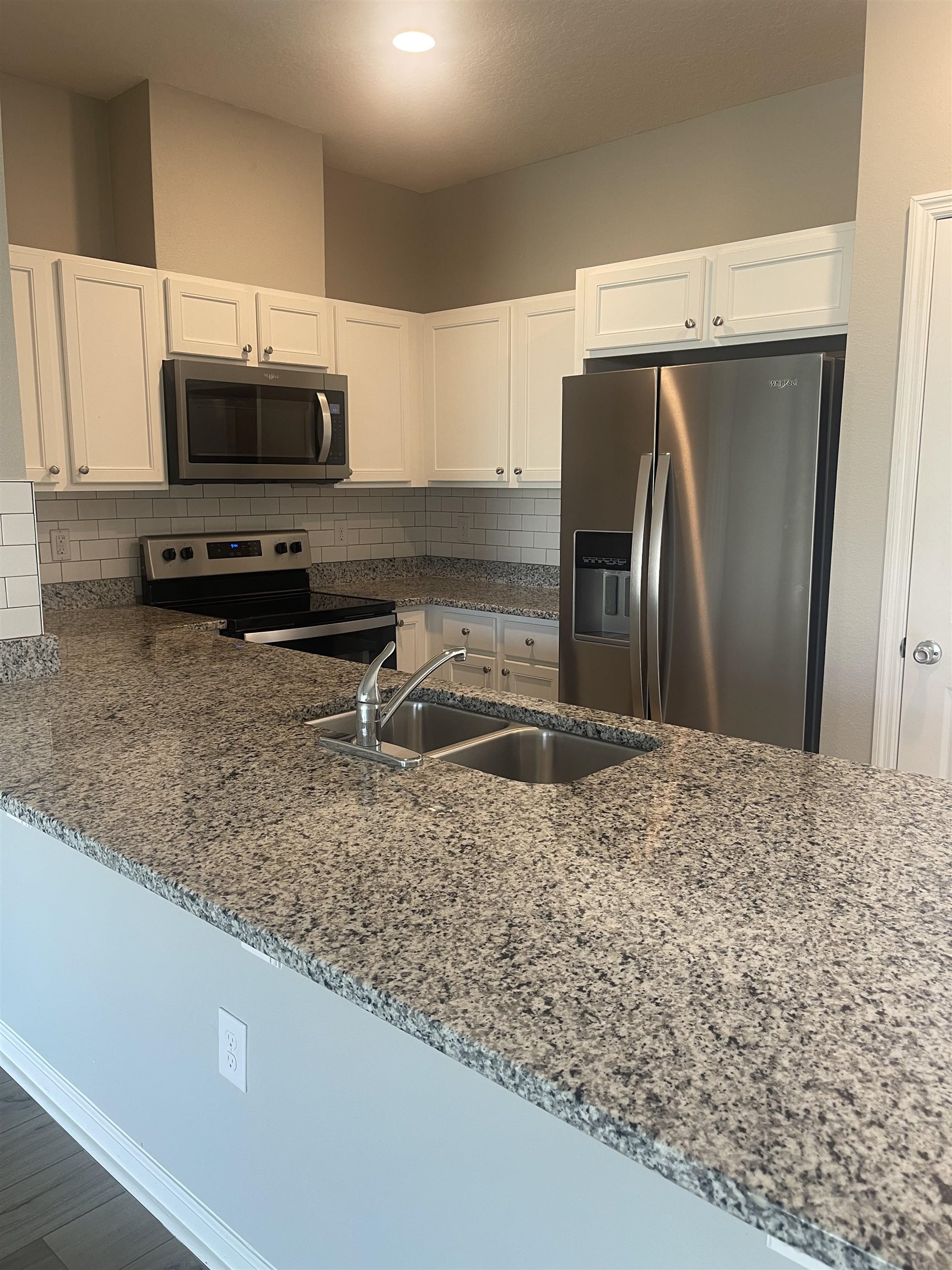 31 Great Star Court St. Augustine, FL 32086 - Photo 5 of 17 a kitchen with a refrigerator sink and microwave