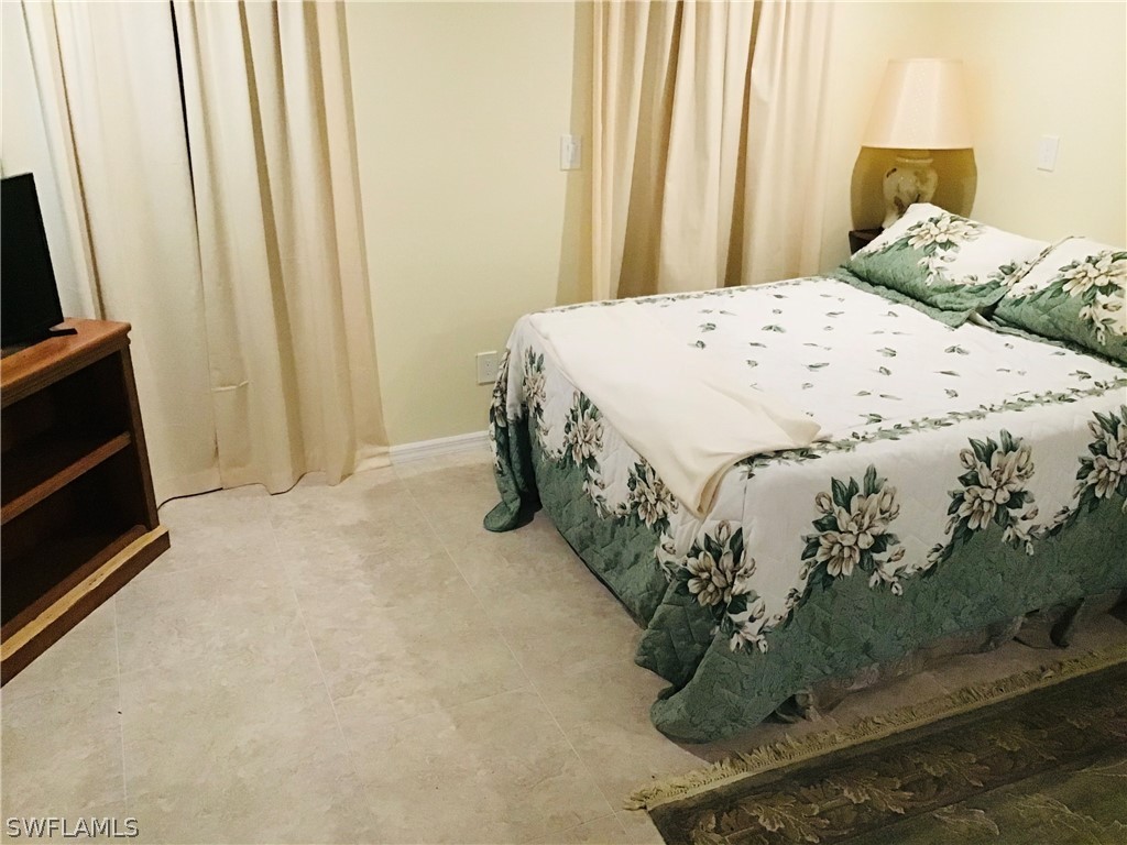 15291 Broken J Ranch Road Fort Myers, FL 33905 - Photo 14 of 33 a bedroom with a bed and a window
