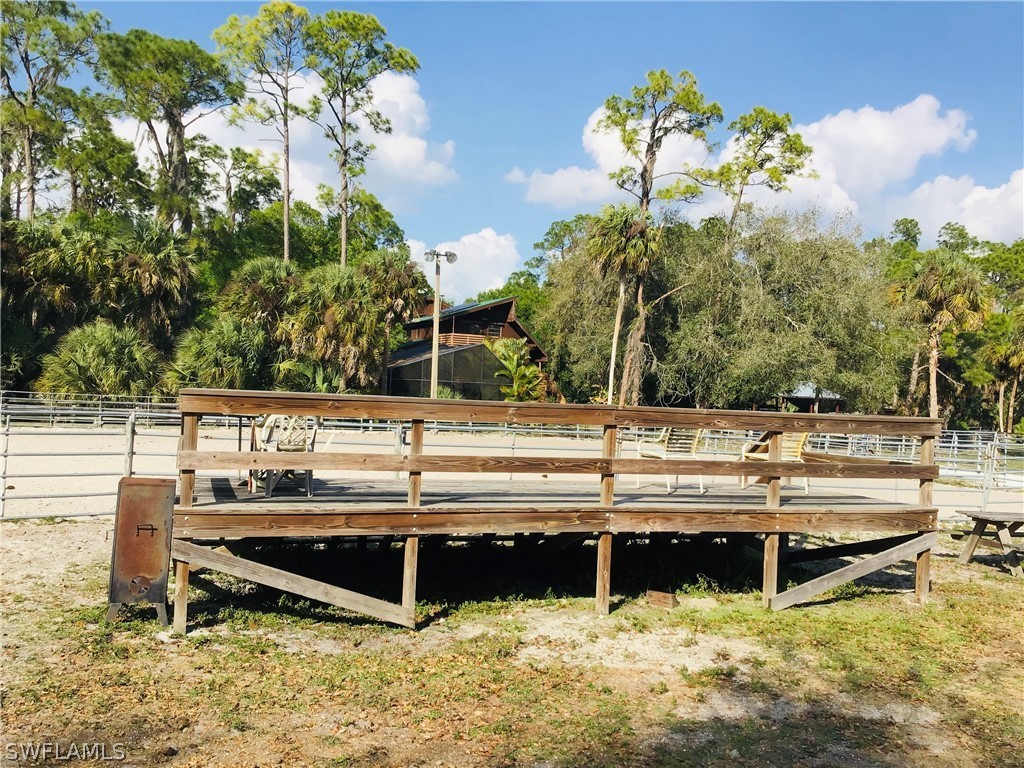 15291 Broken J Ranch Road Fort Myers, FL 33905 - Photo 22 of 33 a swimming pool with outdoor seating