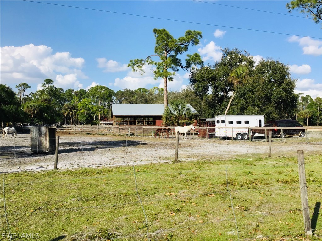 15291 Broken J Ranch Road Fort Myers, FL 33905 - Photo 24 of 33 a swimming pool with view of lake