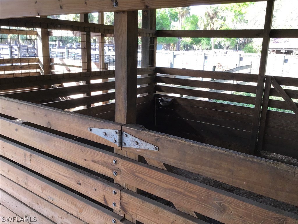 15291 Broken J Ranch Road Fort Myers, FL 33905 - Photo 28 of 33 a view of room with wooden floor