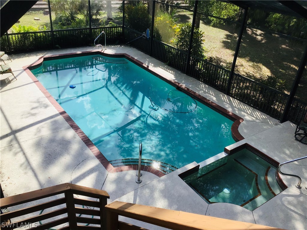 15291 Broken J Ranch Road Fort Myers, FL 33905 - Photo 7 of 33 a view of a swimming pool with a patio