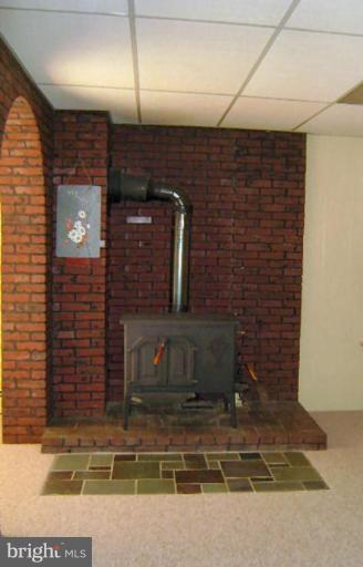 326 Old Joppa Road Fallston, MD 21047 - Photo 24 of 30 Wood Burning Stove in LL Rec Room w/AC & heat