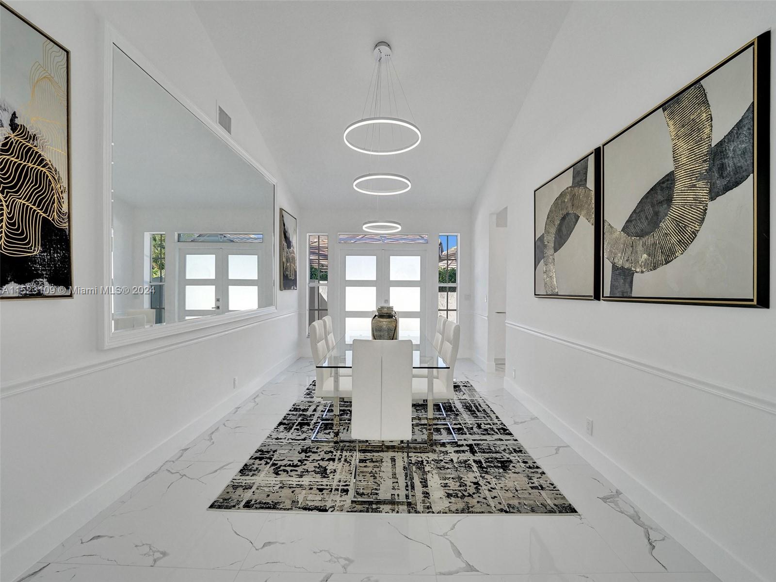 791 Parkside Circle North Boca Raton, FL 33486 - Photo 11 of 87 a view of a hallway with a dining table and window