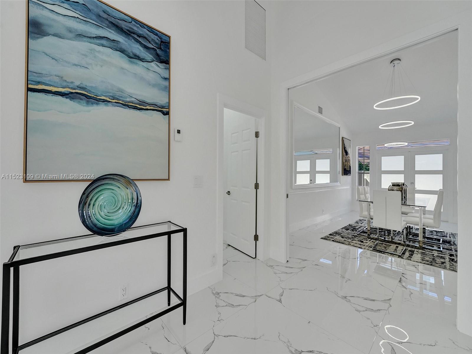 791 Parkside Circle North Boca Raton, FL 33486 - Photo 19 of 87 a view of a hallway with washer and dryer