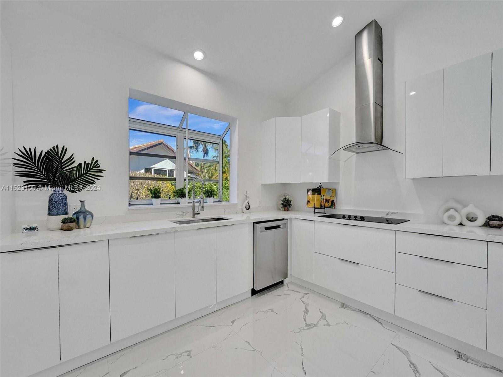 791 Parkside Circle North Boca Raton, FL 33486 - Photo 22 of 87 a kitchen with white cabinets and a stove