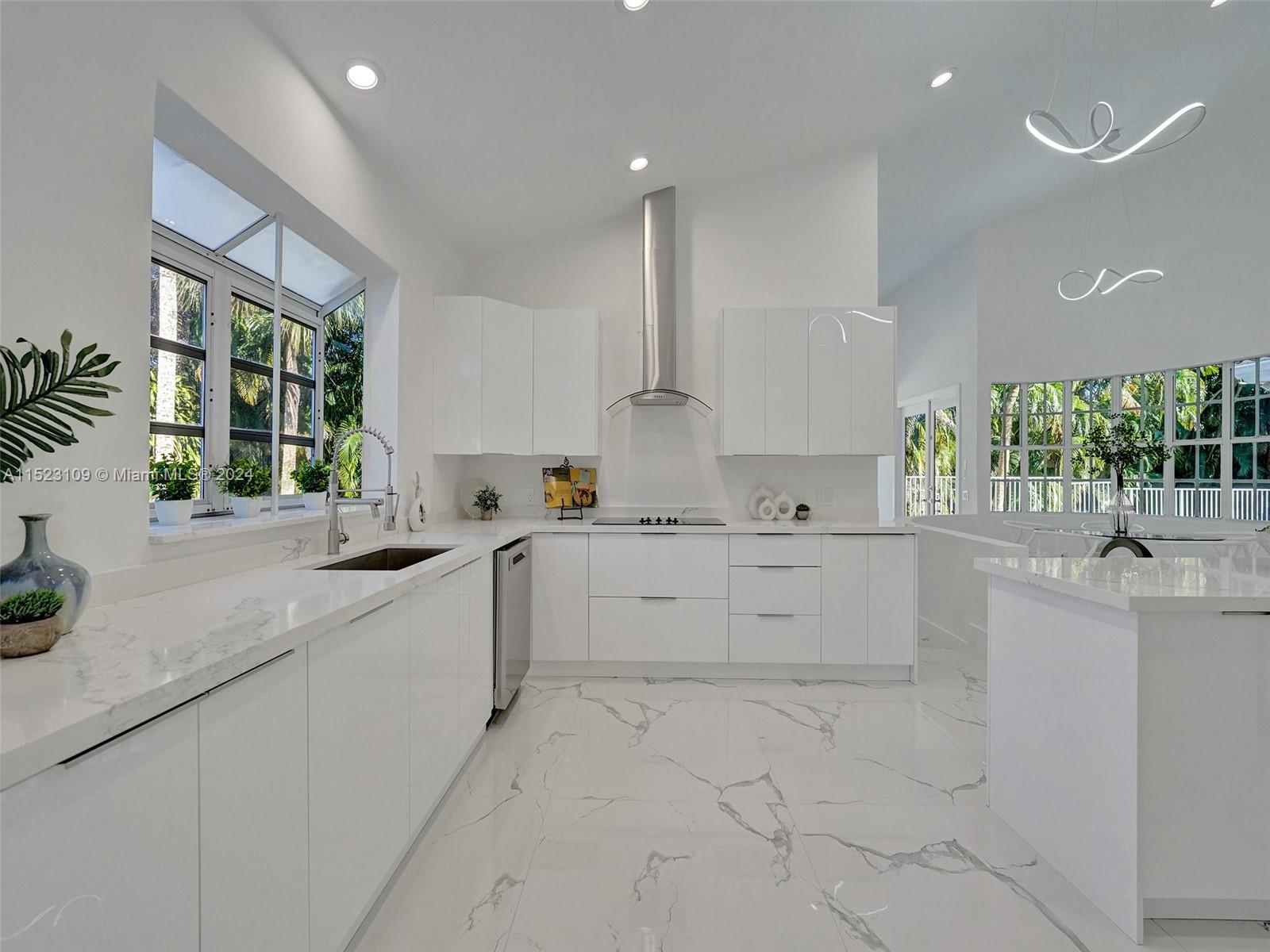 791 Parkside Circle North Boca Raton, FL 33486 - Photo 25 of 87 a kitchen with a white cabinets and window