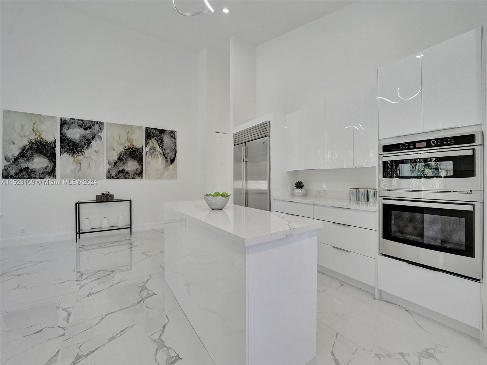 791 Parkside Circle North Boca Raton, FL 33486 - Photo 26 of 87 a kitchen with granite countertop white cabinets and white appliances
