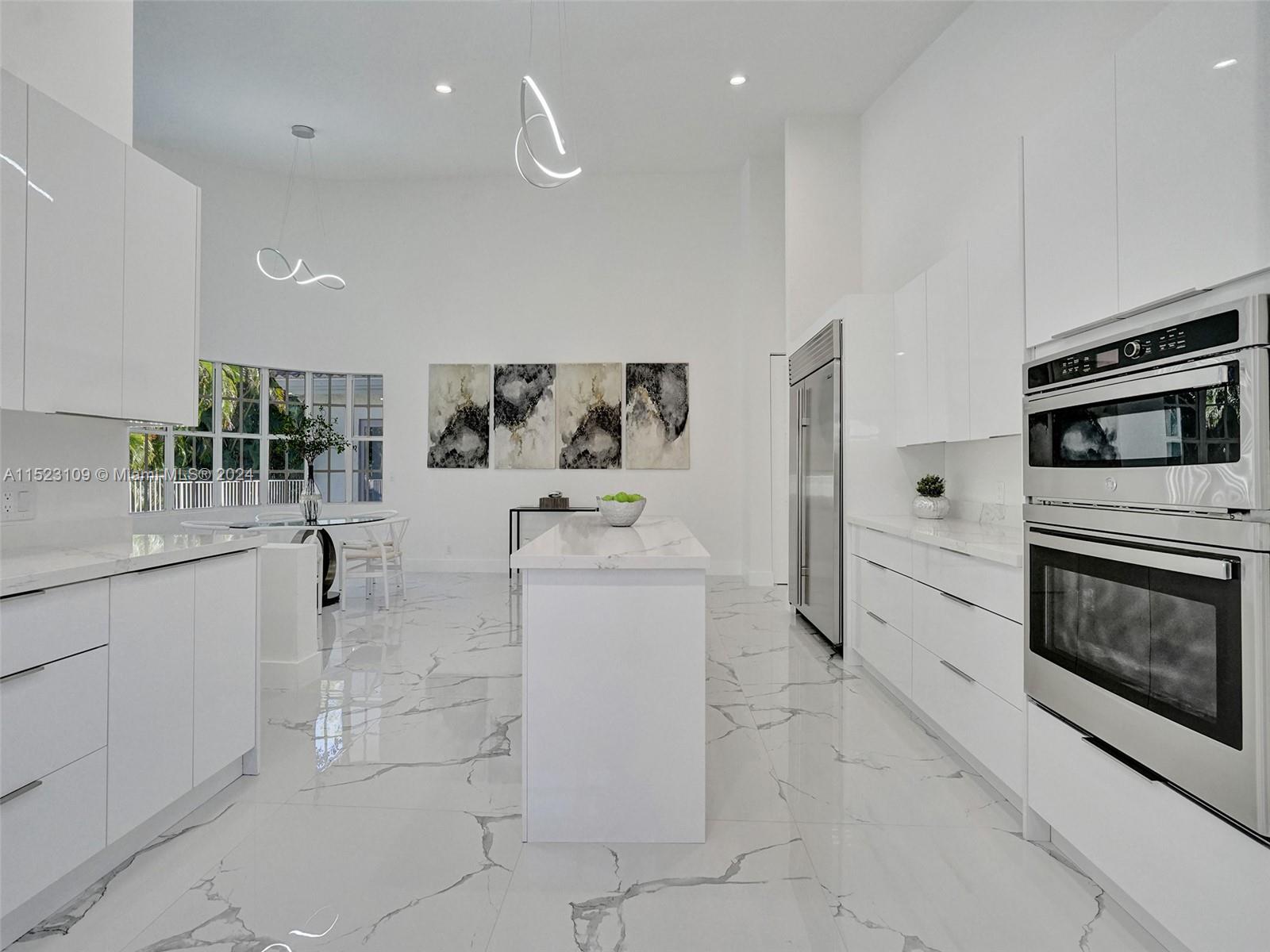791 Parkside Circle North Boca Raton, FL 33486 - Photo 28 of 87 a kitchen with a stove a sink and a microwave