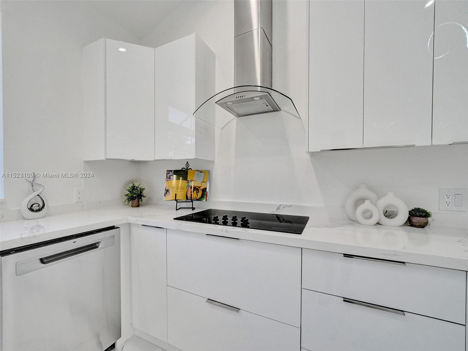 791 Parkside Circle North Boca Raton, FL 33486 - Photo 29 of 87 a kitchen with white cabinets and appliances
