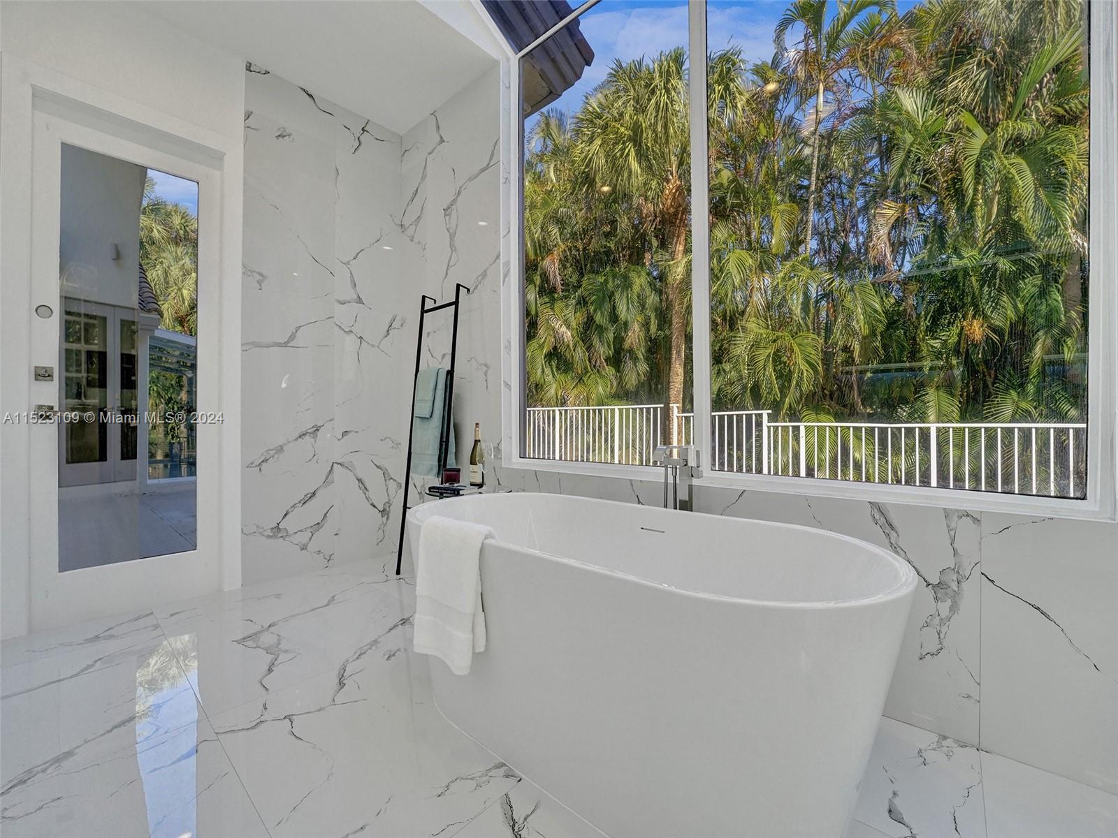 791 Parkside Circle North Boca Raton, FL 33486 - Photo 31 of 87 a white bath tub sitting in front of a window