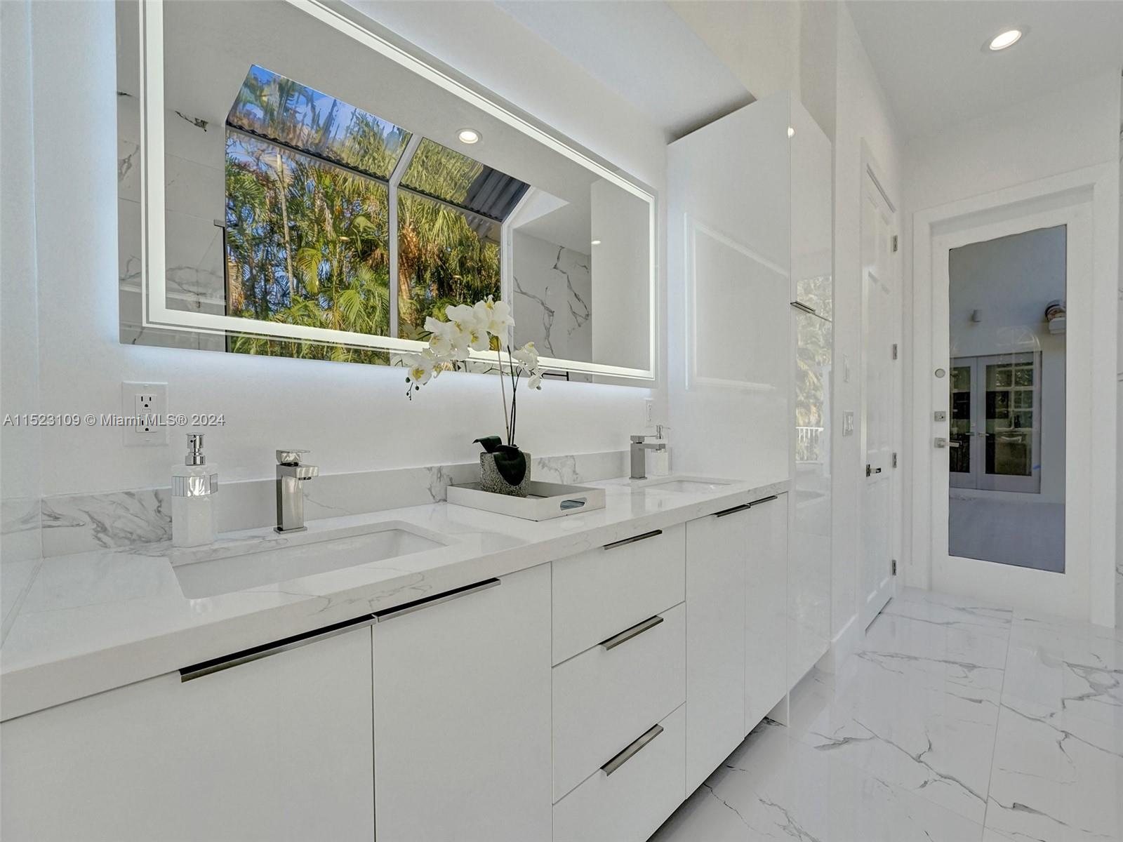 791 Parkside Circle North Boca Raton, FL 33486 - Photo 33 of 87 a bathroom with a double vanity sink and a mirror