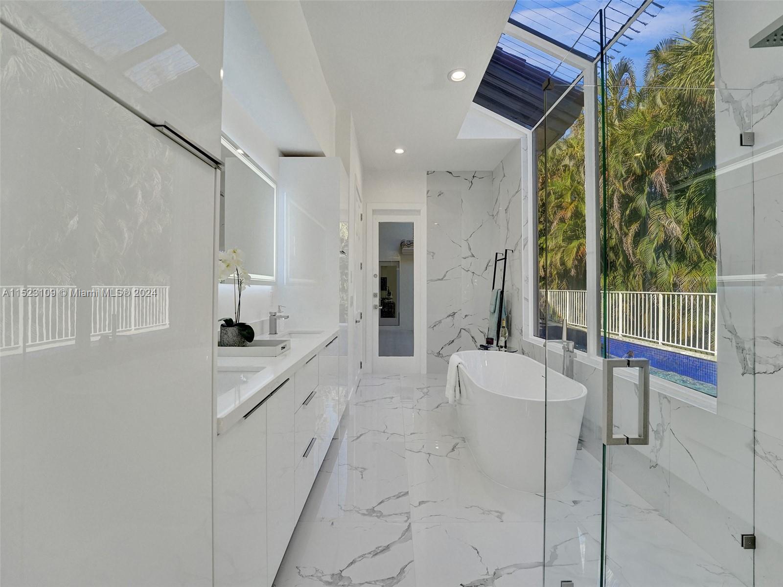 791 Parkside Circle North Boca Raton, FL 33486 - Photo 34 of 87 a large white room with a balcony a sink and cabinets