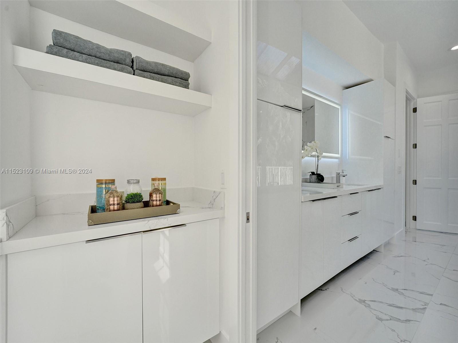 791 Parkside Circle North Boca Raton, FL 33486 - Photo 36 of 87 a bathroom with a sink and a mirror