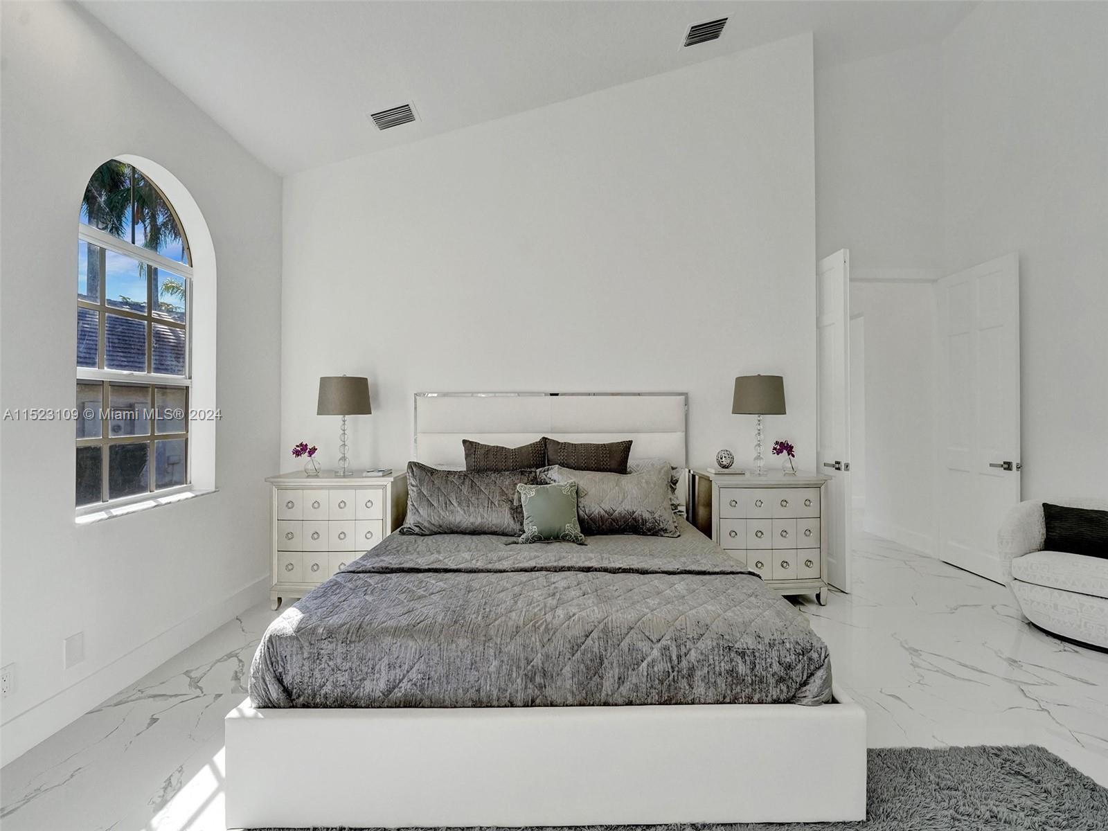 791 Parkside Circle North Boca Raton, FL 33486 - Photo 41 of 87 a large white bed in a white room
