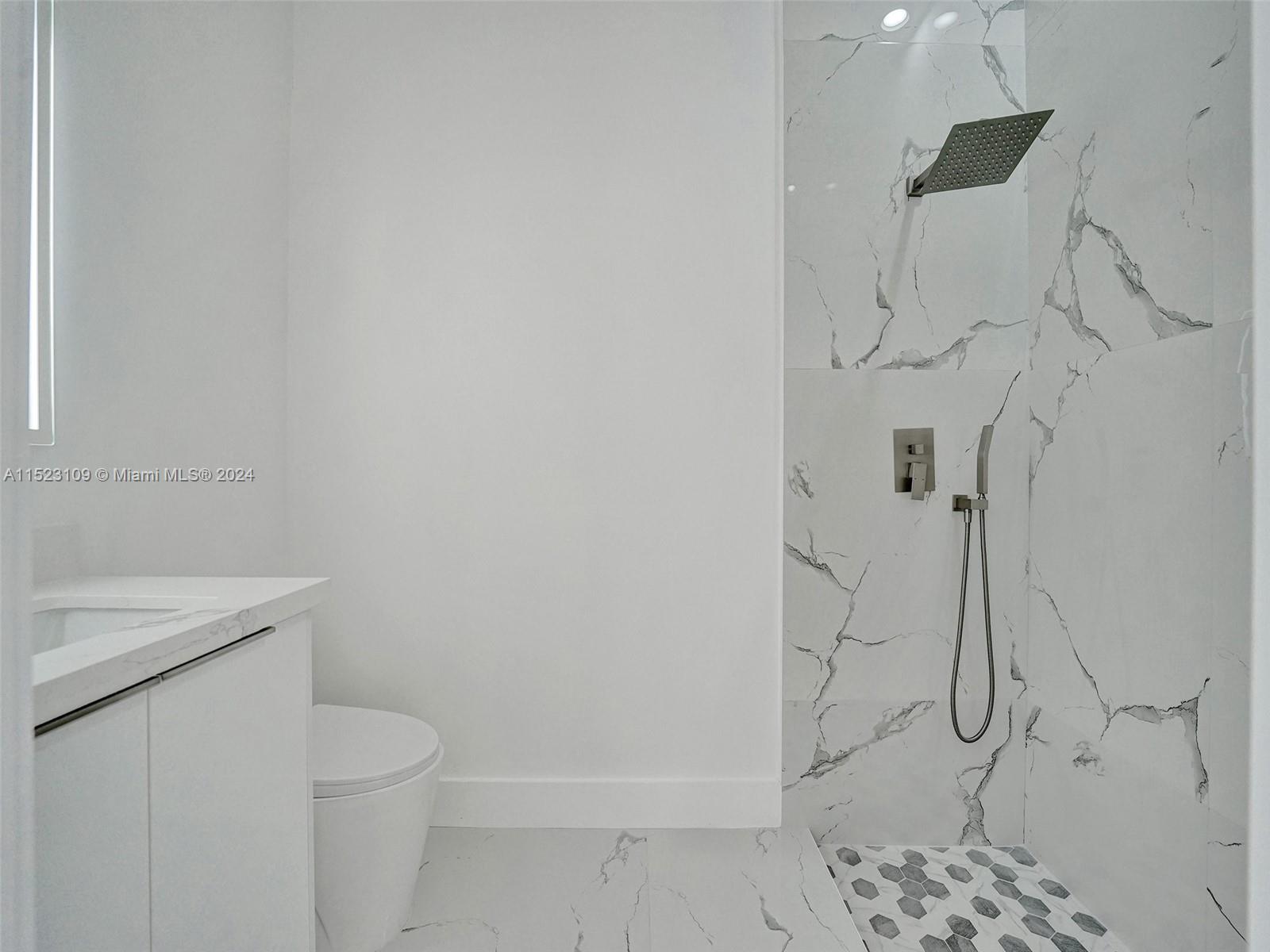 791 Parkside Circle North Boca Raton, FL 33486 - Photo 50 of 87 a bathroom with a granite countertop toilet and a sink