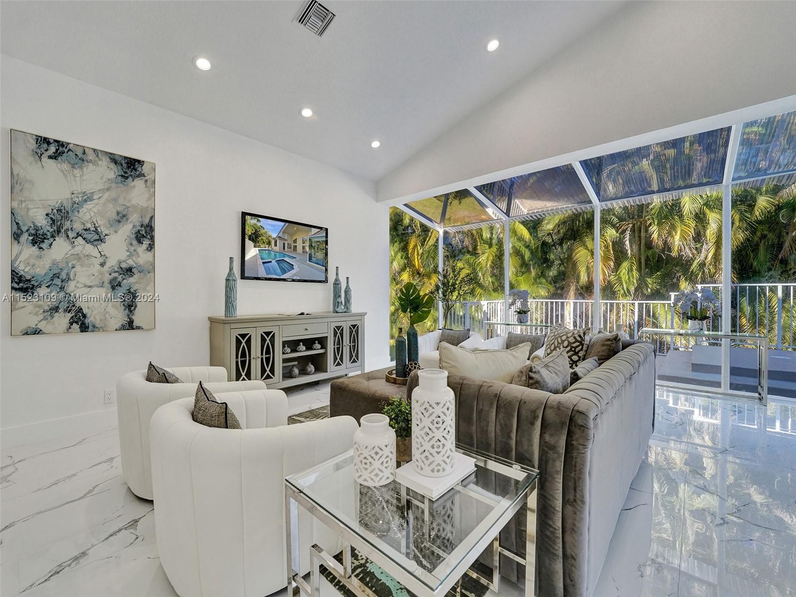 791 Parkside Circle North Boca Raton, FL 33486 - Photo 54 of 87 a living room with fireplace furniture and a large window
