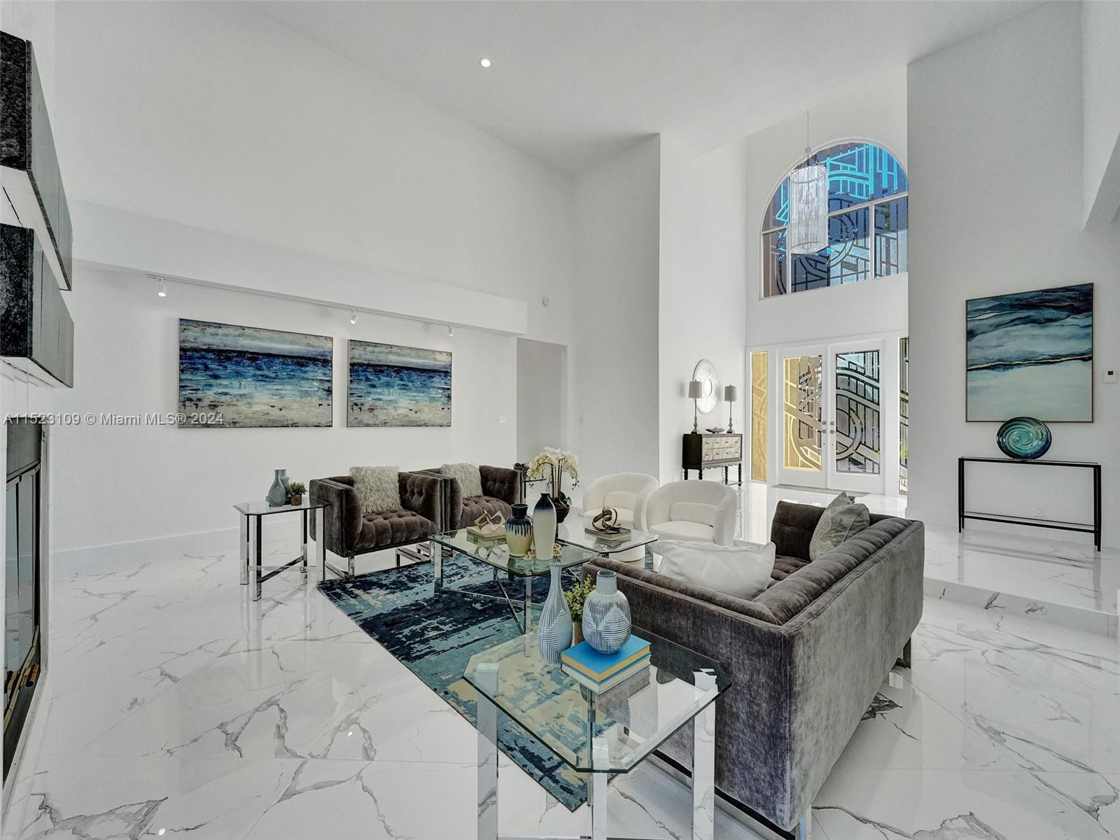 791 Parkside Circle North Boca Raton, FL 33486 - Photo 61 of 87 a living room with fireplace furniture and a floor to ceiling window