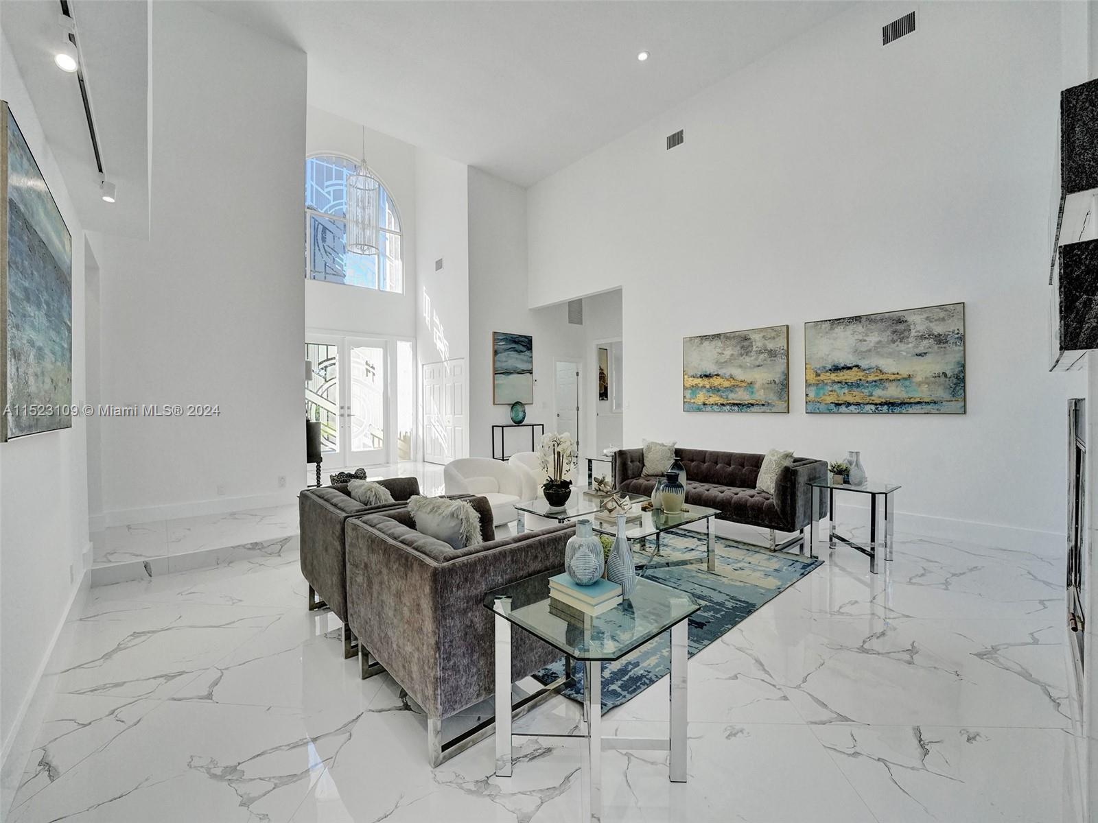 791 Parkside Circle North Boca Raton, FL 33486 - Photo 62 of 87 a living room with furniture and a potted plant