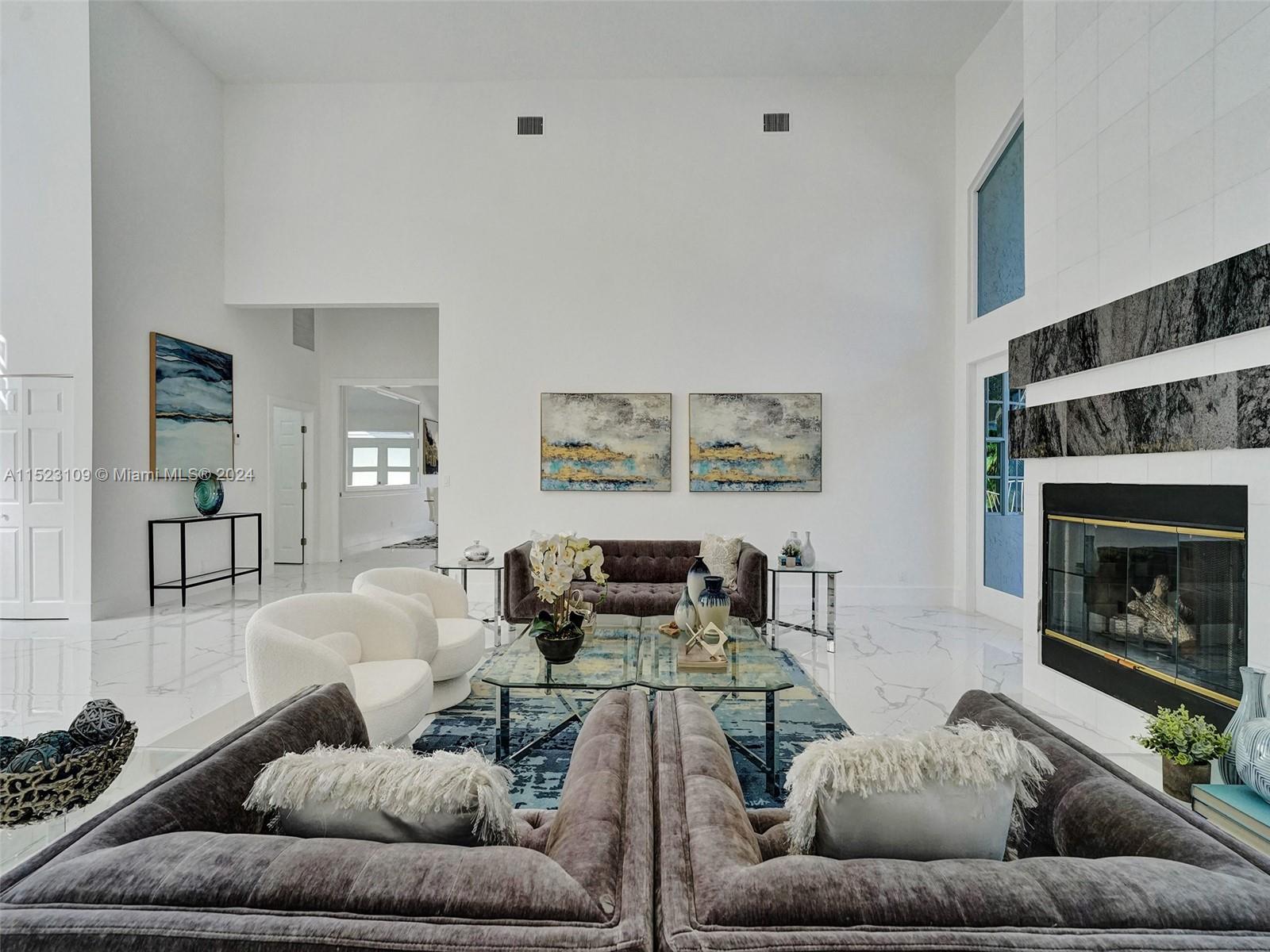 791 Parkside Circle North Boca Raton, FL 33486 - Photo 64 of 87 a living room with furniture and a fireplace