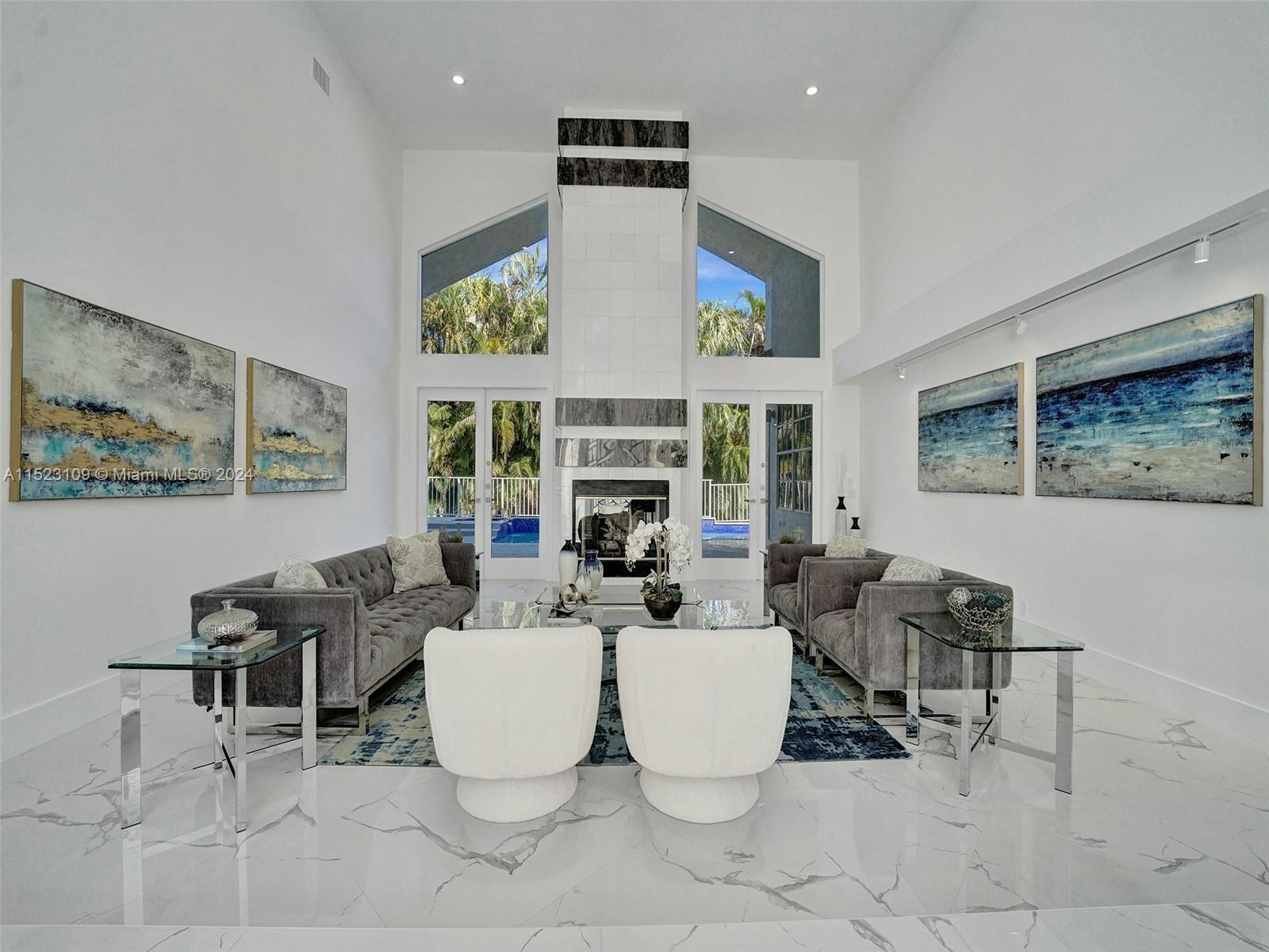 791 Parkside Circle North Boca Raton, FL 33486 - Photo 7 of 87 a living room with fireplace furniture and a large window