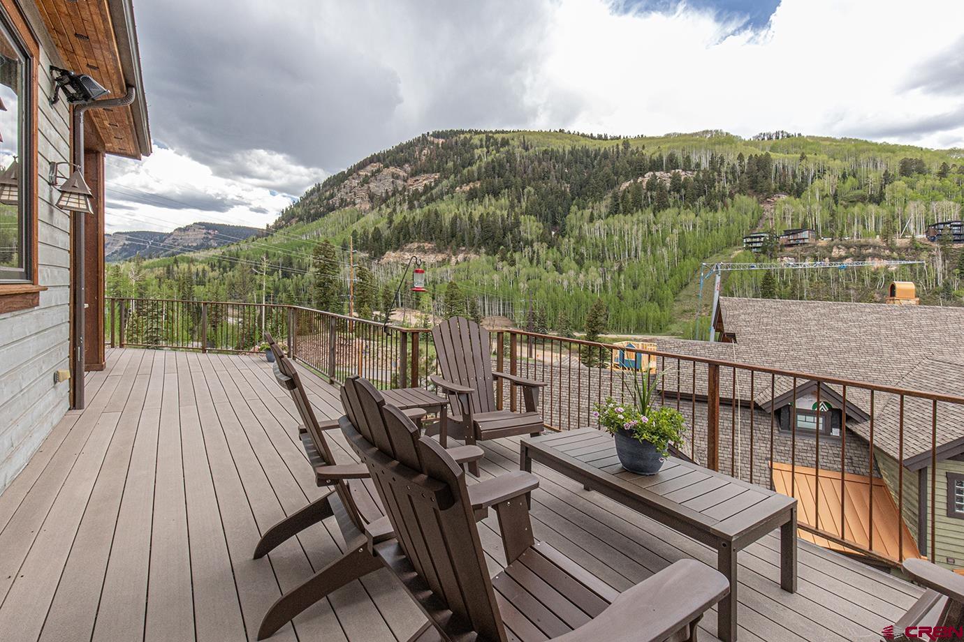 59 Snowden Drive Durango, CO 81301 - Photo 12 of 45 a view of a balcony with wooden floor and outdoor seating
