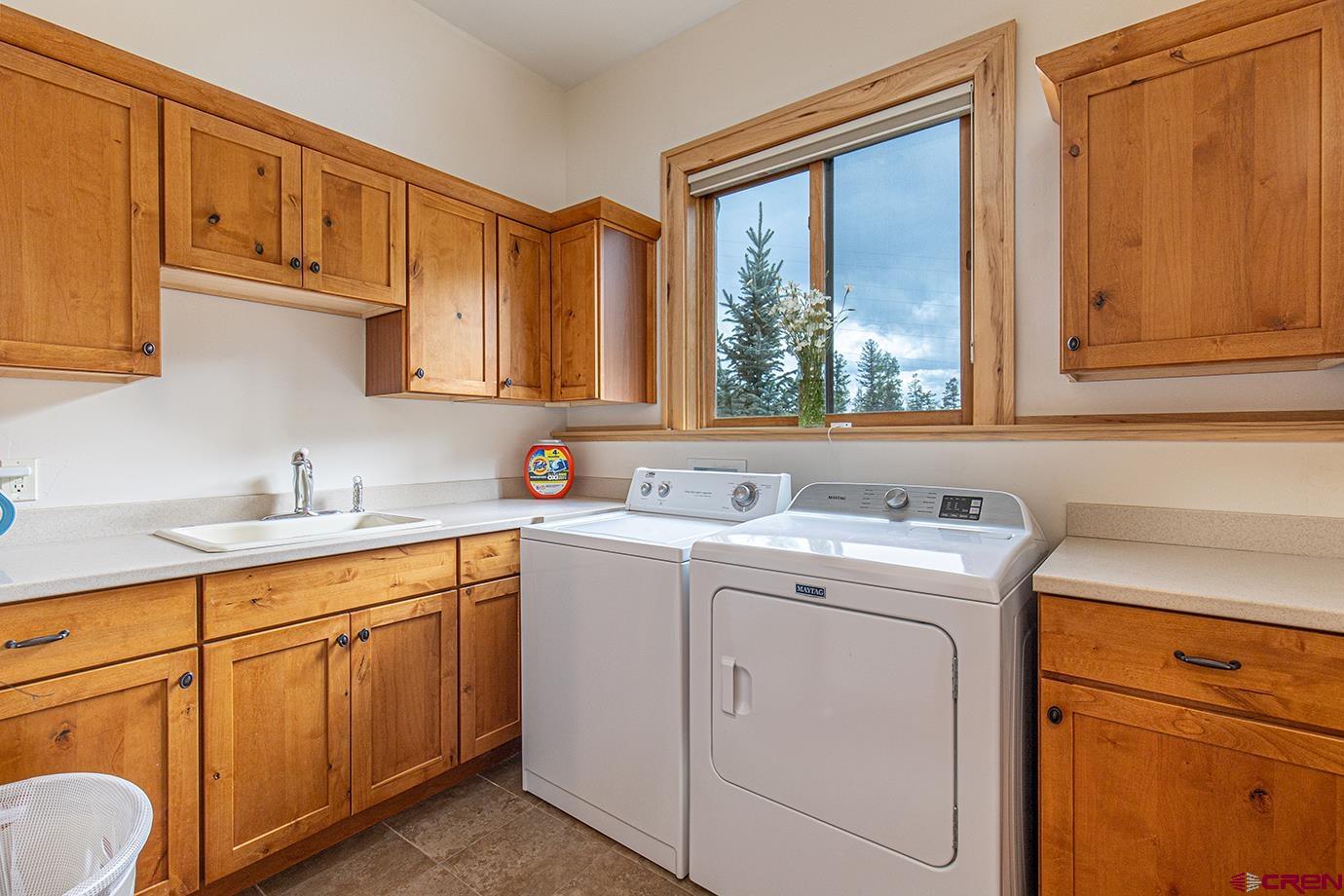 59 Snowden Drive Durango, CO 81301 - Photo 21 of 45 a view of a sink and dishwasher with a washer dryer