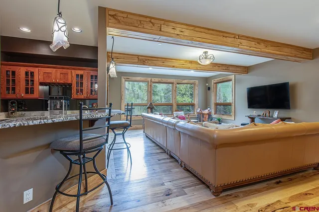 a kitchen with stainless steel appliances granite countertop a stove and a refrigerator