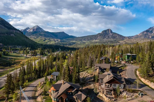 a view of a city with mountains in the background
