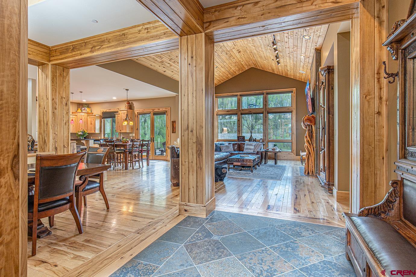 59 Snowden Drive Durango, CO 81301 - Photo 5 of 45 a view of a living room and a dining room with furniture wooden floor and a chandelier