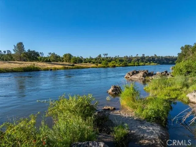 a view of a lake with houses in the back
