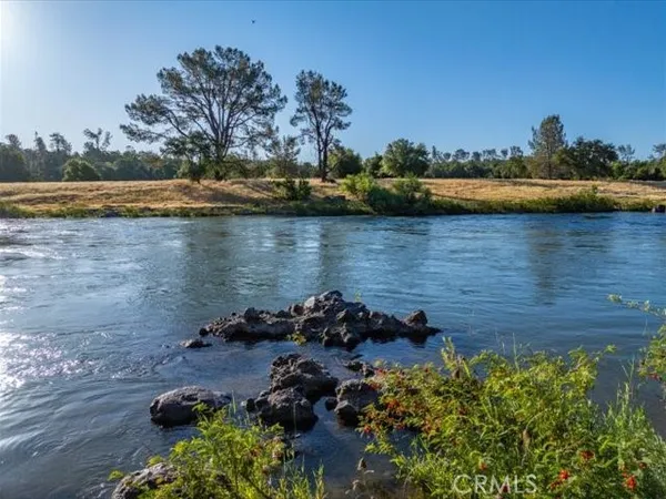 a view of a lake with houses in the back