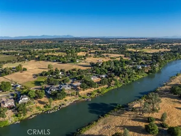 a view of a dirt road with trees