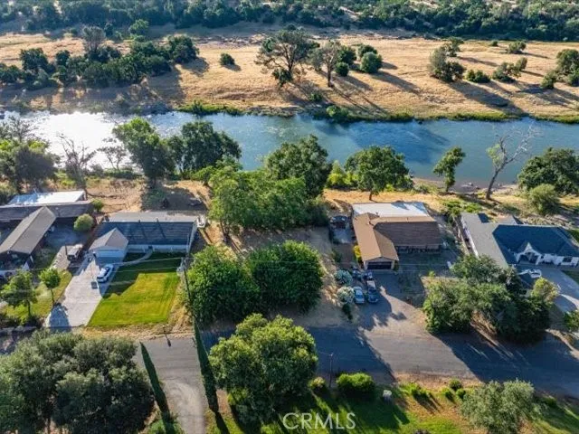 an aerial view of a house with a lake view
