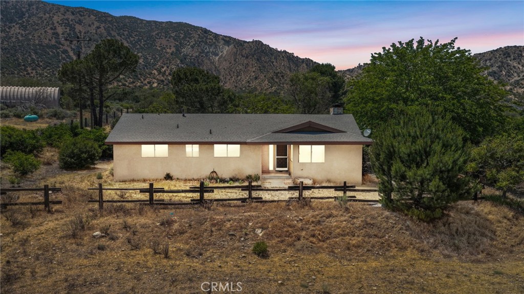 5500 Oil Well Road Phelan, CA 92371 - Photo 1 of 65 a view of a big house with a yard and sitting area