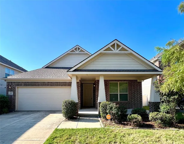 a front view of a house with yard